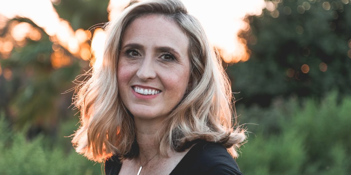 smiling woman in shallow focus photography