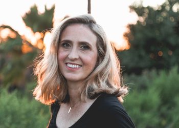 smiling woman in shallow focus photography