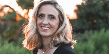 smiling woman in shallow focus photography